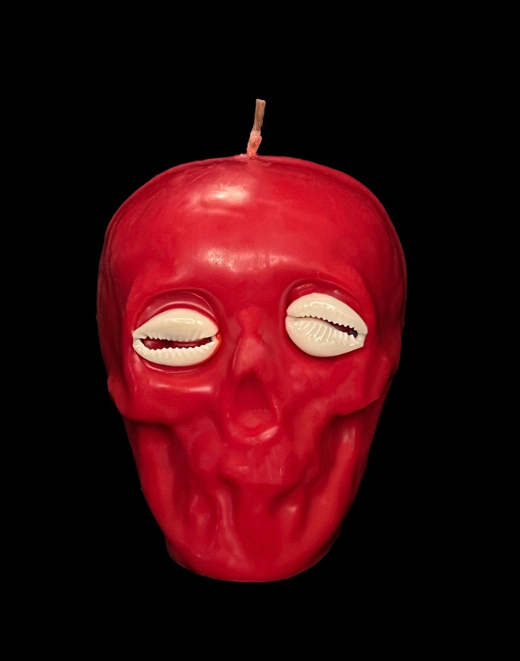 Skull Candle with Cowrie Eyes