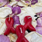 Three HIV/AIDS Awareness Red Ribbon Candles